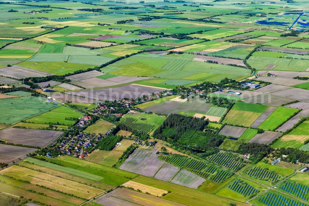 Aerial image Uphusum - Village view on the edge of agricultural fields and land in Uphusum in the state Schleswig-Holstein, Germany