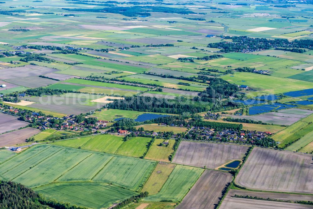 Uphusum from above - Village view on the edge of agricultural fields and land in Uphusum in the state Schleswig-Holstein, Germany