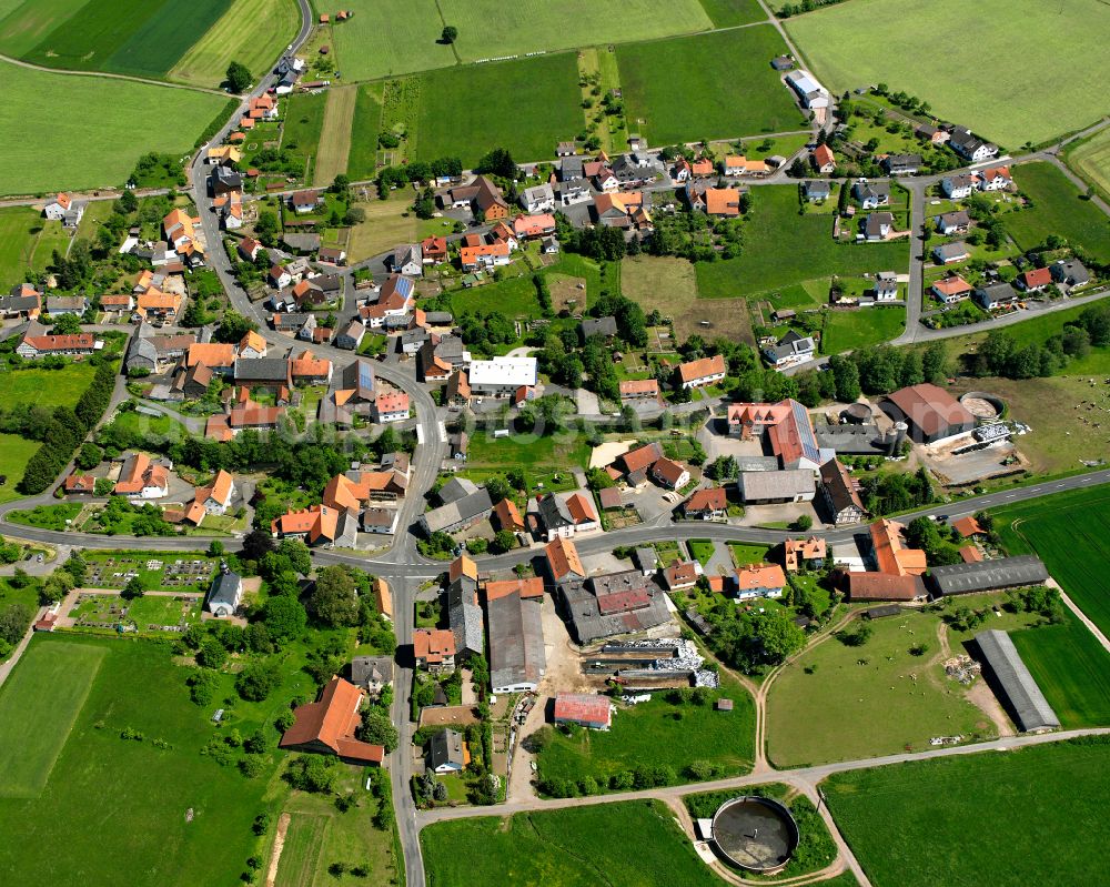 Vadenrod from the bird's eye view: Village view on the edge of agricultural fields and land in Vadenrod in the state Hesse, Germany