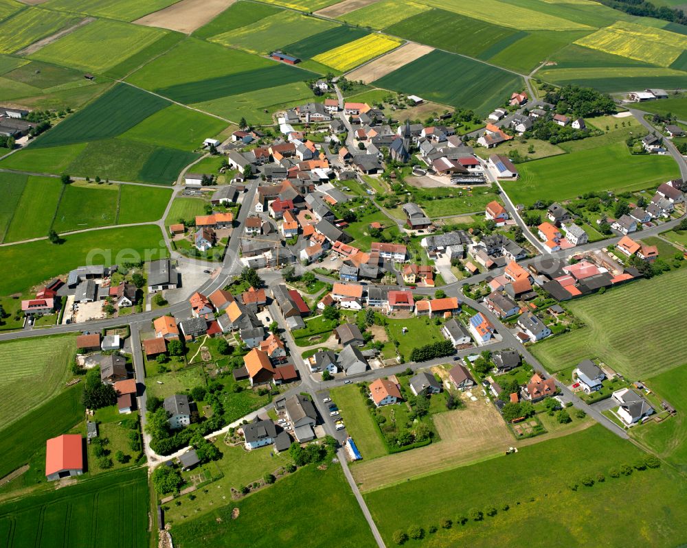 Vockenrod from the bird's eye view: Village view on the edge of agricultural fields and land in Vockenrod in the state Hesse, Germany