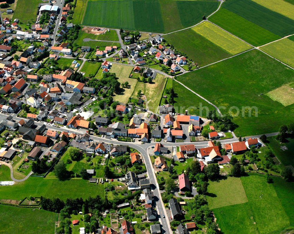 Wallenrod from the bird's eye view: Village view on the edge of agricultural fields and land in Wallenrod in the state Hesse, Germany