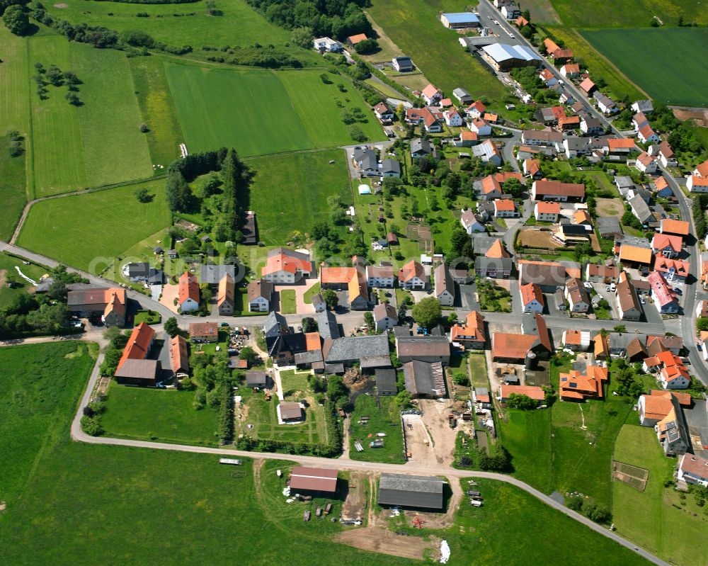 Wallenrod from above - Village view on the edge of agricultural fields and land in Wallenrod in the state Hesse, Germany