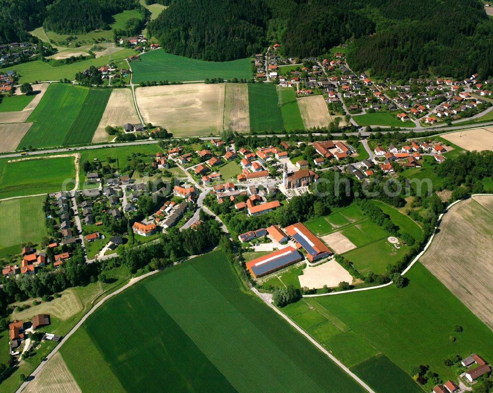 Aerial image Waltersdorf - Village view on the edge of agricultural fields and land in Waltersdorf in the state Bavaria, Germany