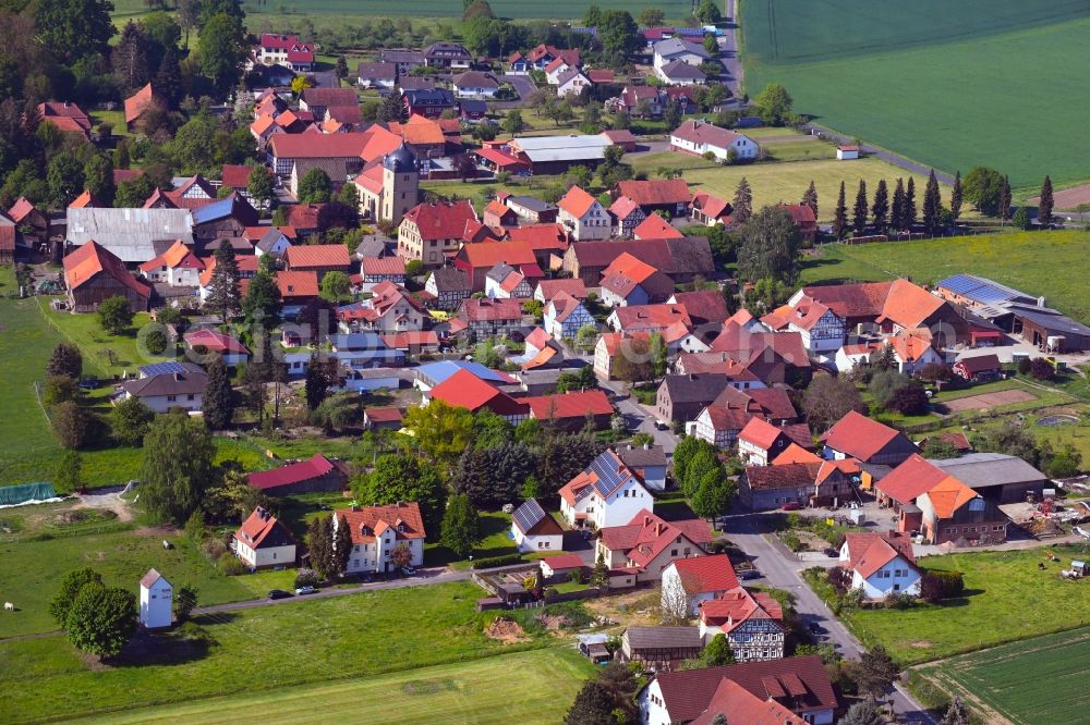 Wehrda from above - Village view on the edge of agricultural fields and land in Wehrda in the state Hesse, Germany