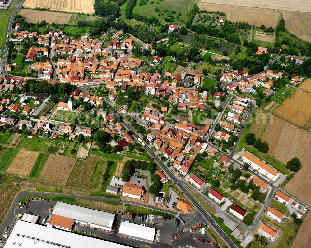 Weinbergen from the bird's eye view: Village view on the edge of agricultural fields and land in Weinbergen in the state Thuringia, Germany