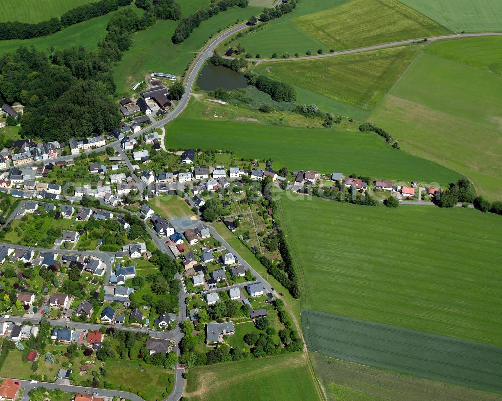 Weißdorf from the bird's eye view: Village view on the edge of agricultural fields and land in Weißdorf in the state Bavaria, Germany