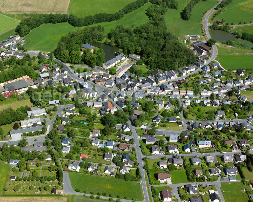 Aerial image Weißdorf - Village view on the edge of agricultural fields and land in Weißdorf in the state Bavaria, Germany