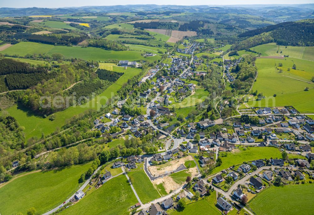 Wenholthausen from above - Village view on the edge of agricultural fields and land in Wenholthausen at Sauerland in the state North Rhine-Westphalia, Germany