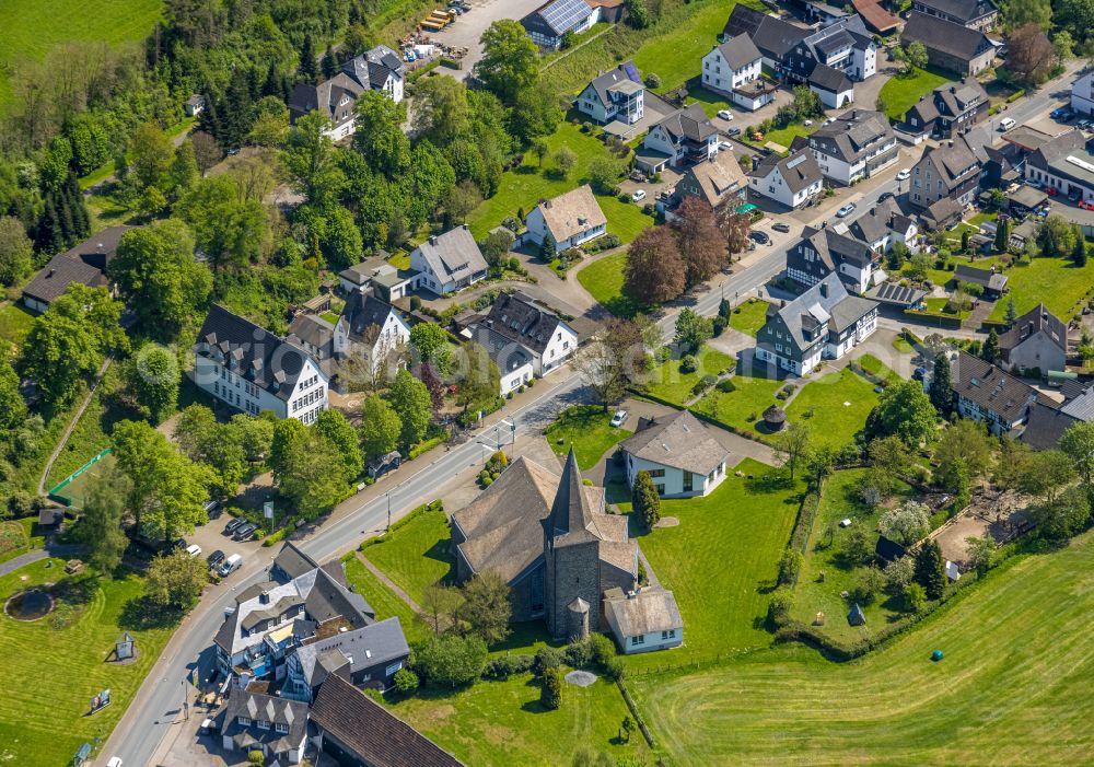 Wenholthausen from the bird's eye view: Village view on the edge of agricultural fields and land in Wenholthausen at Sauerland in the state North Rhine-Westphalia, Germany