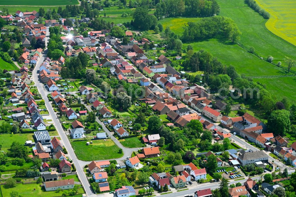 Westhausen from the bird's eye view: Village view on the edge of agricultural fields and land in Westhausen in the state Thuringia, Germany