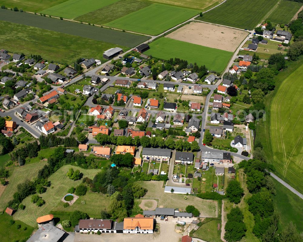 Wiedelah from above - Village view on the edge of agricultural fields and land in Wiedelah in the state Lower Saxony, Germany