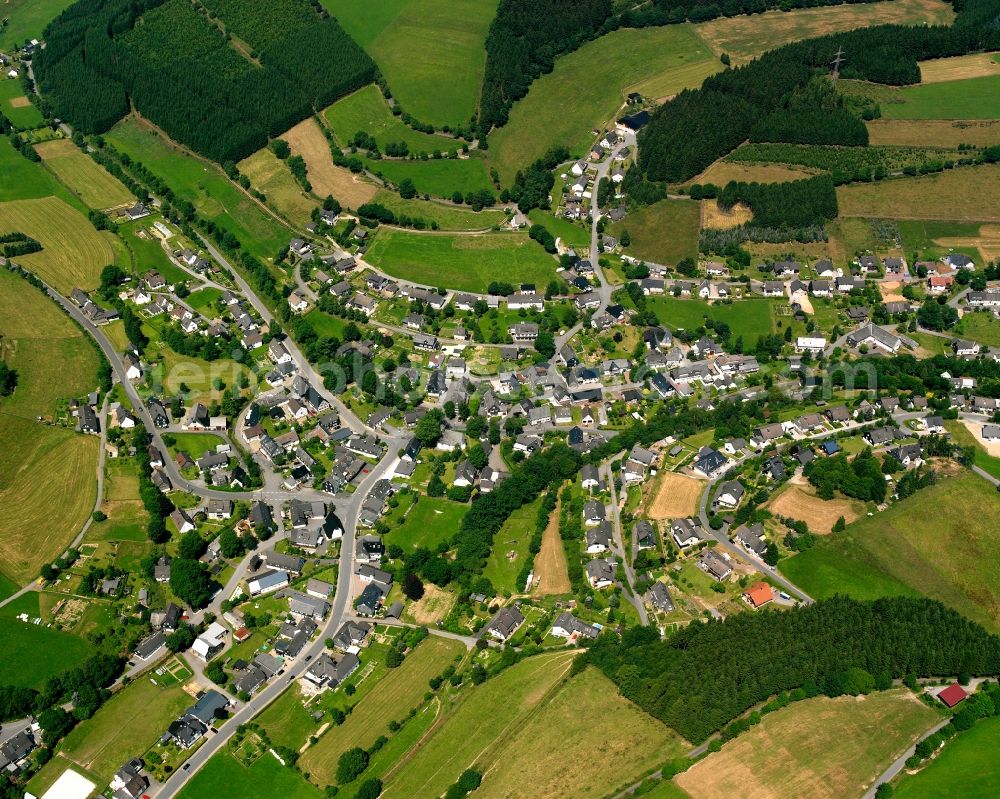 Wingeshausen from the bird's eye view: Village view on the edge of agricultural fields and land in Wingeshausen in the state North Rhine-Westphalia, Germany