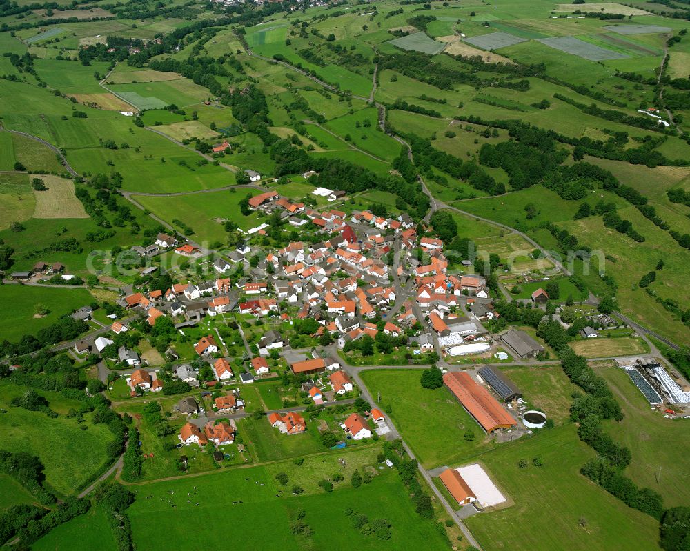 Aerial photograph Wohnfeld - Village view on the edge of agricultural fields and land in Wohnfeld in the state Hesse, Germany