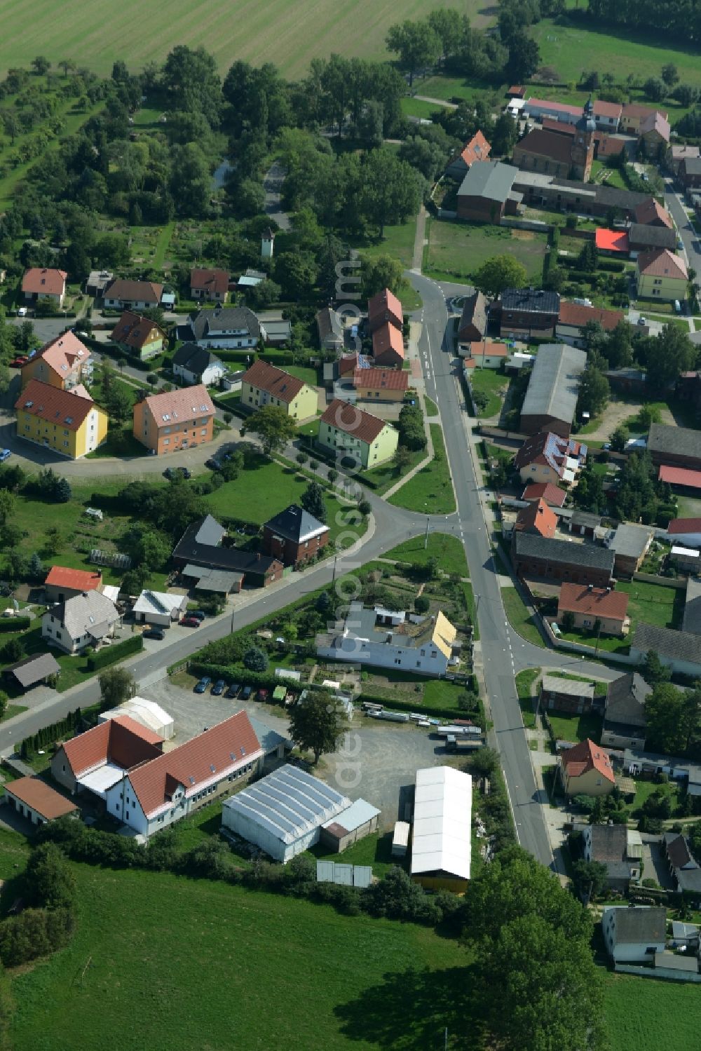 Rödgen from the bird's eye view: View of the borough of Roedgen in the state of Saxony. The village is located in the county district of North Saxony, surrounded by hills and fields and consists of residential buildings