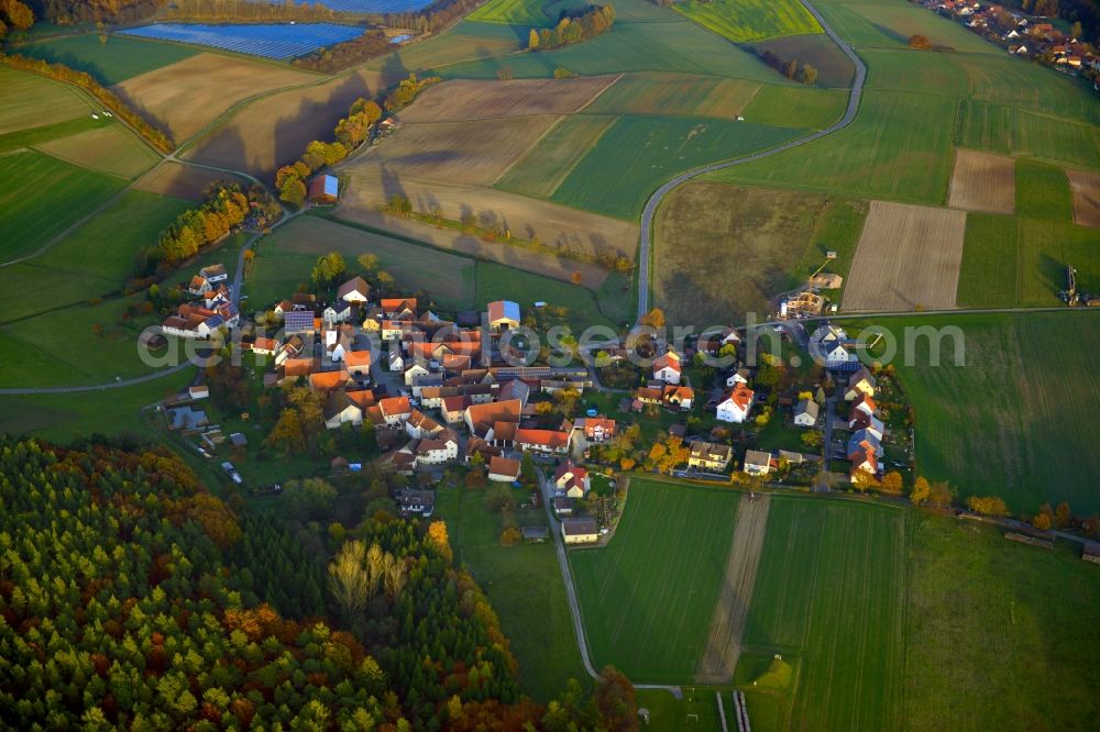 Aerial image Reutersbrunn - View of the village of Reutersbrunn in the state of Bavaria. Reutersbrunn is located in the county district of Hassberge and is surrounded by agricultural fields