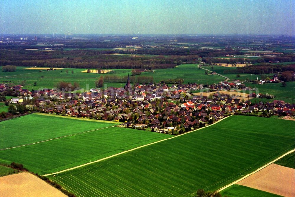 Rheurdt from the bird's eye view: Town View of the streets and houses of the residential areas in Rheurdt in the state North Rhine-Westphalia