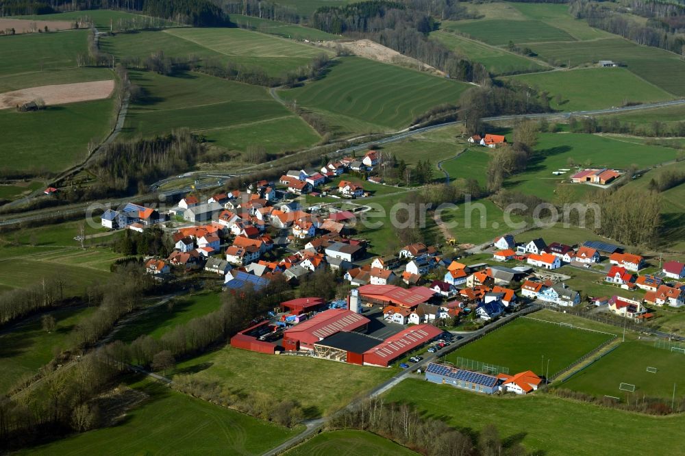 Aerial photograph Brand - Town view of the streets, houses of the residential areas and the industrial area in Brand in the Rhoen in the state Hesse, Germany