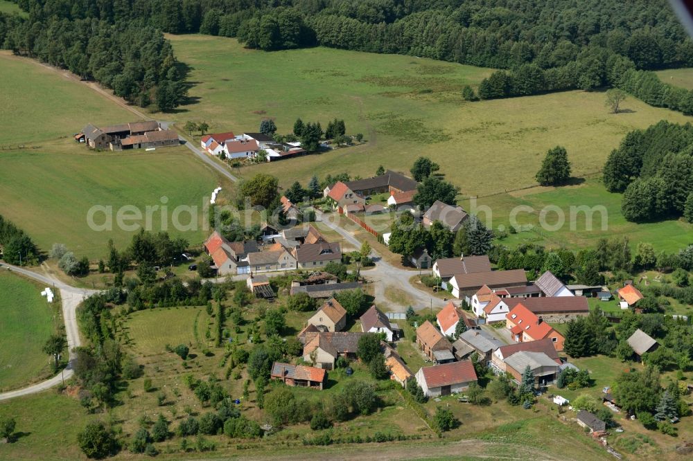 Aerial photograph Schrakau - View of the village of Schrakau in the state of Brandenburg. The residential village is located in the forest area of the nature park of Niederlausitzer Landruecken