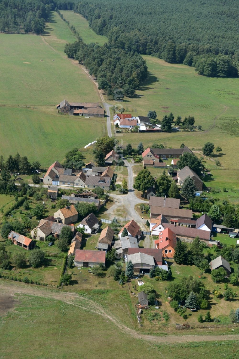 Schrakau from above - View of the village of Schrakau in the state of Brandenburg. The residential village is located in the forest area of the nature park of Niederlausitzer Landruecken