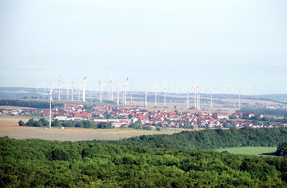 Aerial image Dingelstädt - City view with silhouette of a group of wind power plants in Dingelstaedt in the state Thuringia, Germany