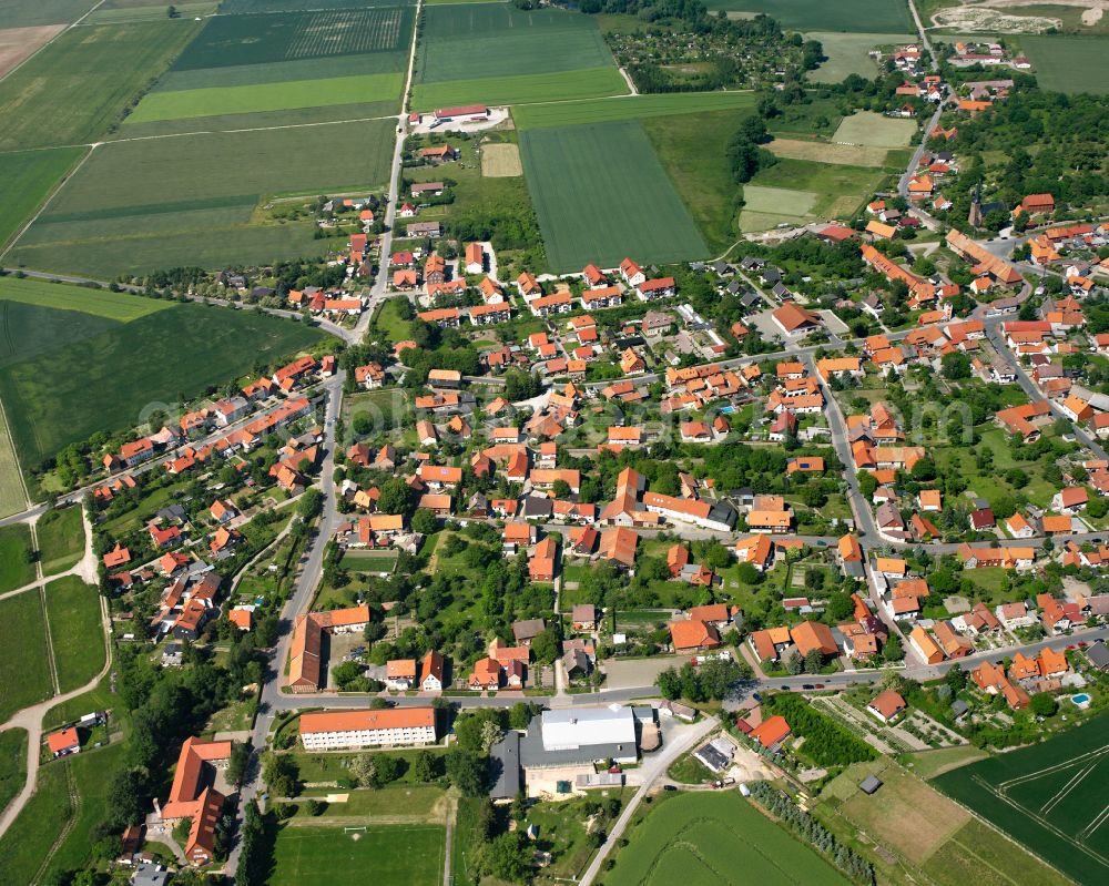 Stapelburg from above - Town View of the streets and houses of the residential areas in Stapelburg in the state Saxony-Anhalt, Germany