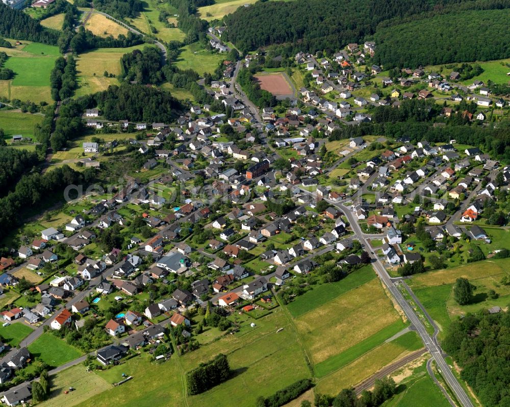 Steinebach from the bird's eye view: View of Steinebach in the state of Rhineland-Palatinate. Steinebach is located in a valley of the river Sieg. It is an official tourist resort. Steinebach consists of residential areas and a business park. It is home to the mining pit Bindweide and the Westerwald Museum