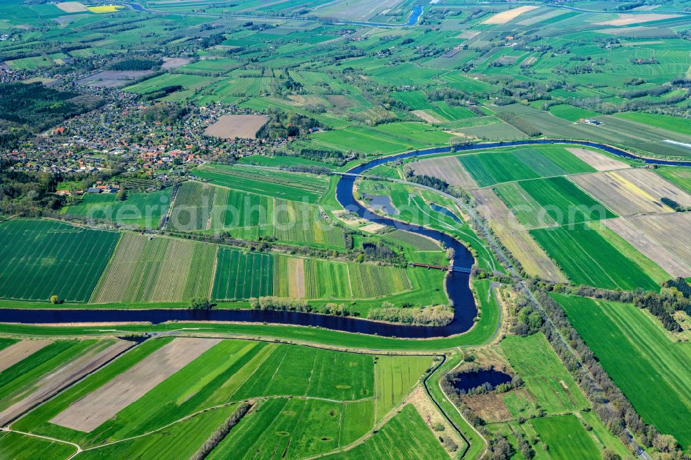 Aerial photograph Hechthausen - City view of the streets and houses of the residential areas in Hechthausen with the river Oste in the state Lower Saxony, Germany