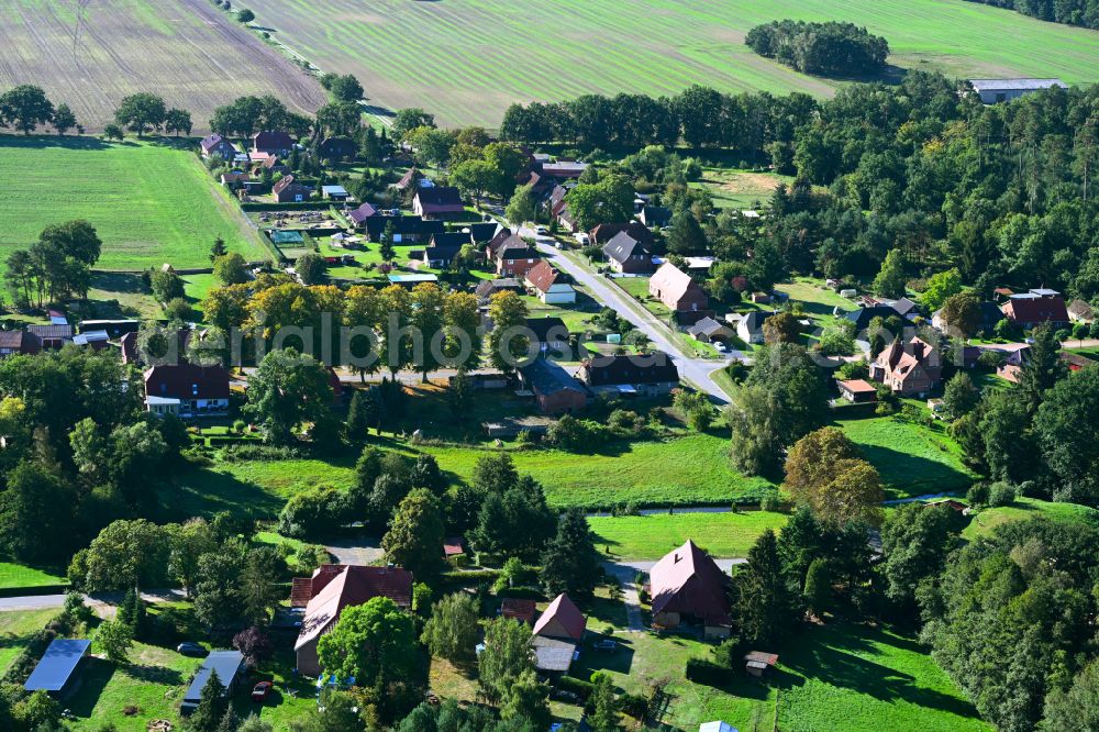 Strohkirchen from above - Town view of the streets and houses of the residential areas along the street Feldweg in Strohkirchen in the state Mecklenburg - Western Pomerania, Germany