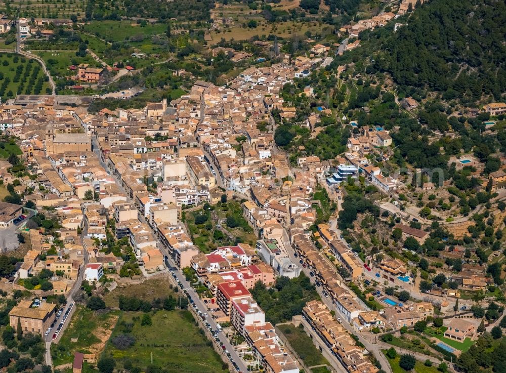 Bunyola from above - Location view of the streets and houses of residential areas in the valley landscape surrounded by mountains in Bunyola in Balearic island of Mallorca, Spain