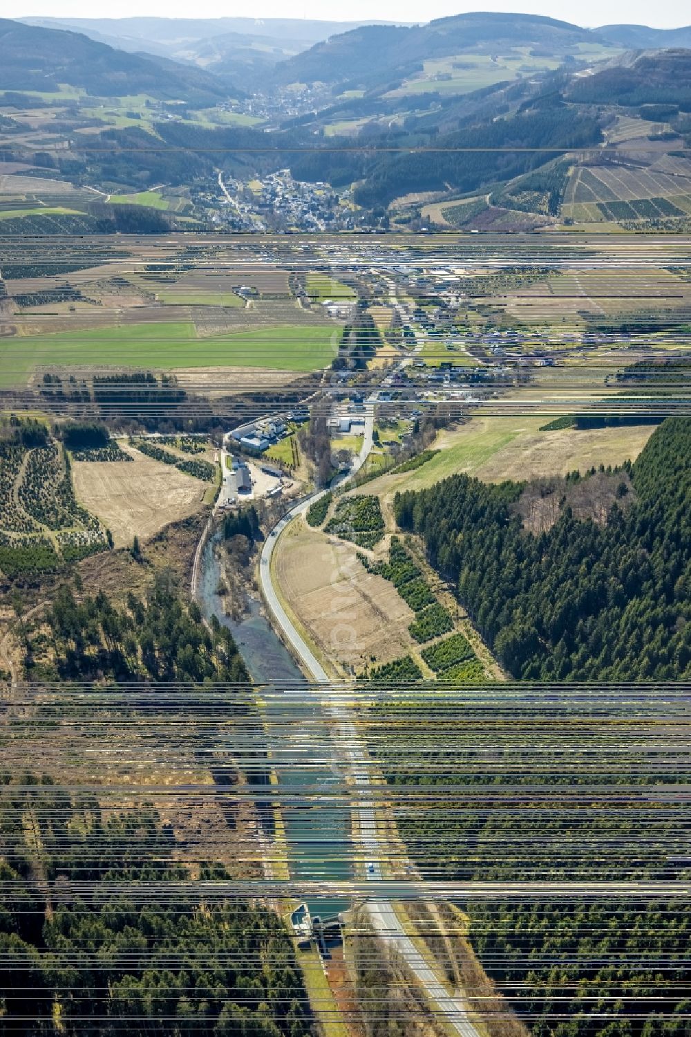 Aerial image Heringhausen - Location view of the streets and houses of residential areas in the valley landscape surrounded by mountains in Heringhausen at Sauerland in the state North Rhine-Westphalia, Germany