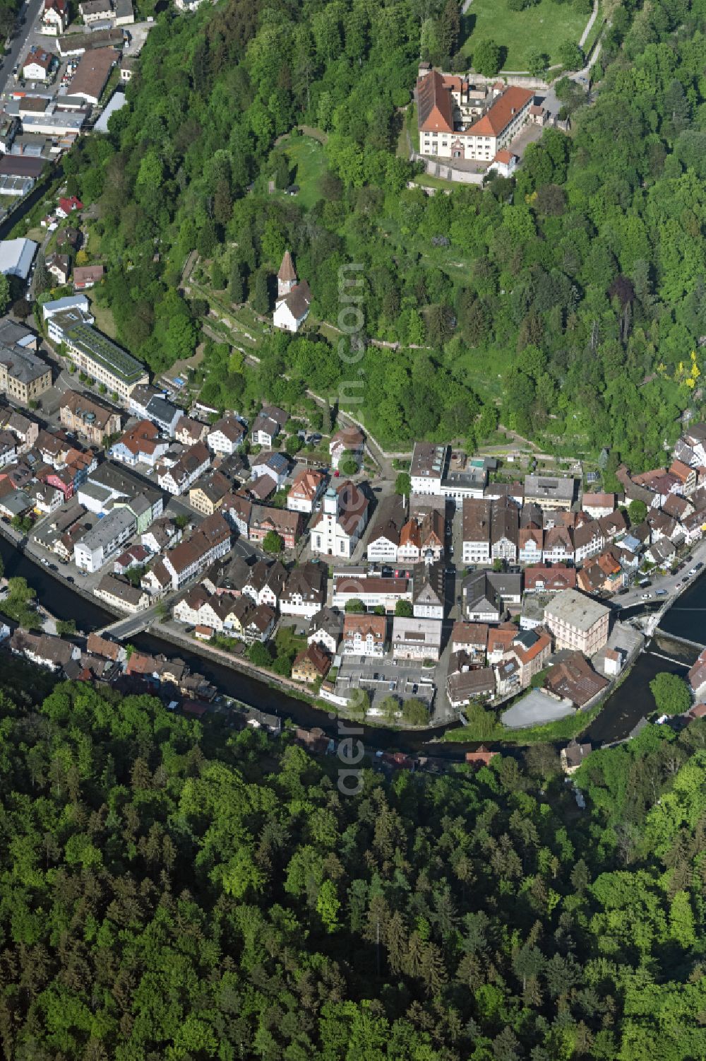 Neuenbürg from above - Location view of the streets and houses of residential areas in the valley landscape surrounded by mountains in Neuenbuerg in the state Baden-Wuerttemberg, Germany