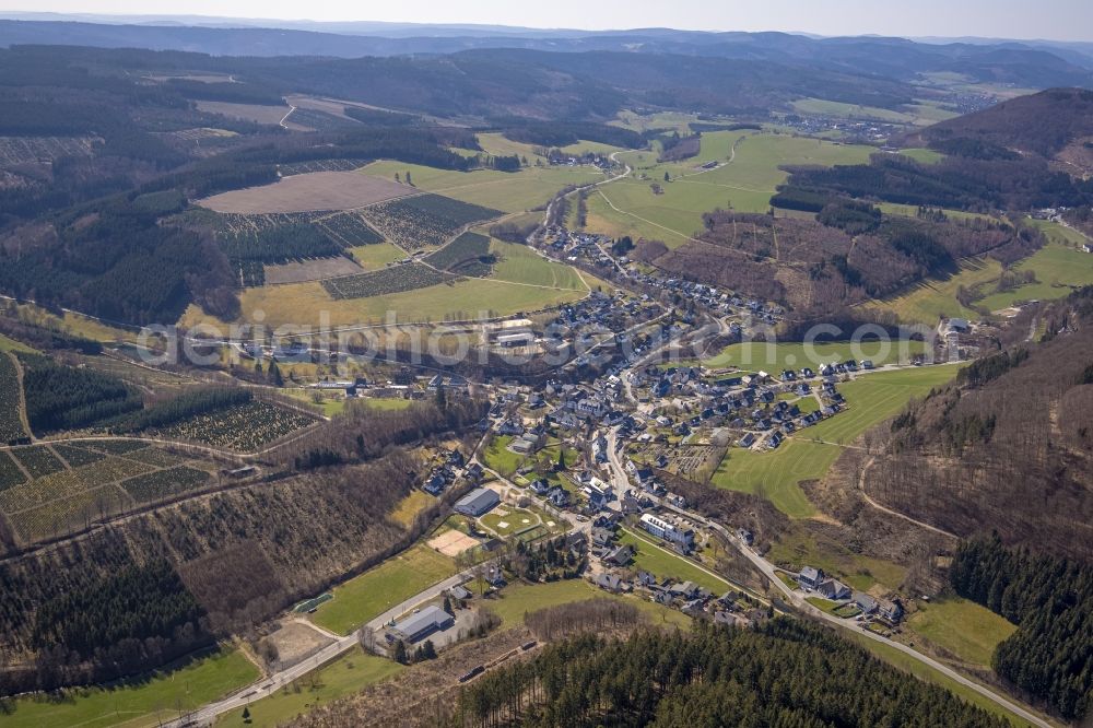 Aerial photograph Oberkirchen - Location view of the streets and houses of residential areas in the valley landscape surrounded by mountains in Oberkirchen at Sauerland in the state North Rhine-Westphalia, Germany