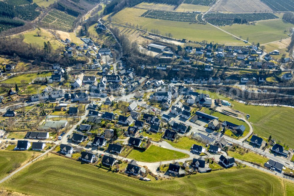 Aerial image Oberkirchen - Location view of the streets and houses of residential areas in the valley landscape surrounded by mountains in Oberkirchen at Sauerland in the state North Rhine-Westphalia, Germany