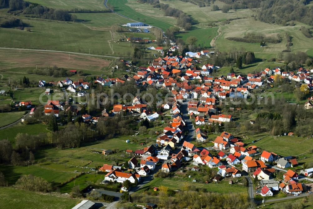 Oberweid from the bird's eye view: View of the streets and houses of the residential areas in the valley of the Rhoen community Oberweid in the state of Thuringia, Germany, which is surrounded by mountains