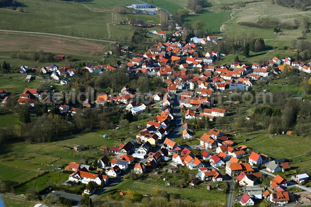 Aerial image Oberweid - View of the streets and houses of the residential areas in the valley of the Rhoen community Oberweid in the state of Thuringia, Germany, which is surrounded by mountains