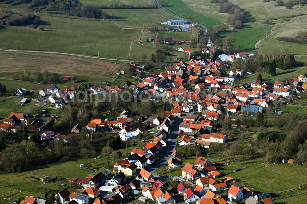 Aerial photograph Oberweid - View of the streets and houses of the residential areas in the valley of the Rhoen community Oberweid in the state of Thuringia, Germany, which is surrounded by mountains