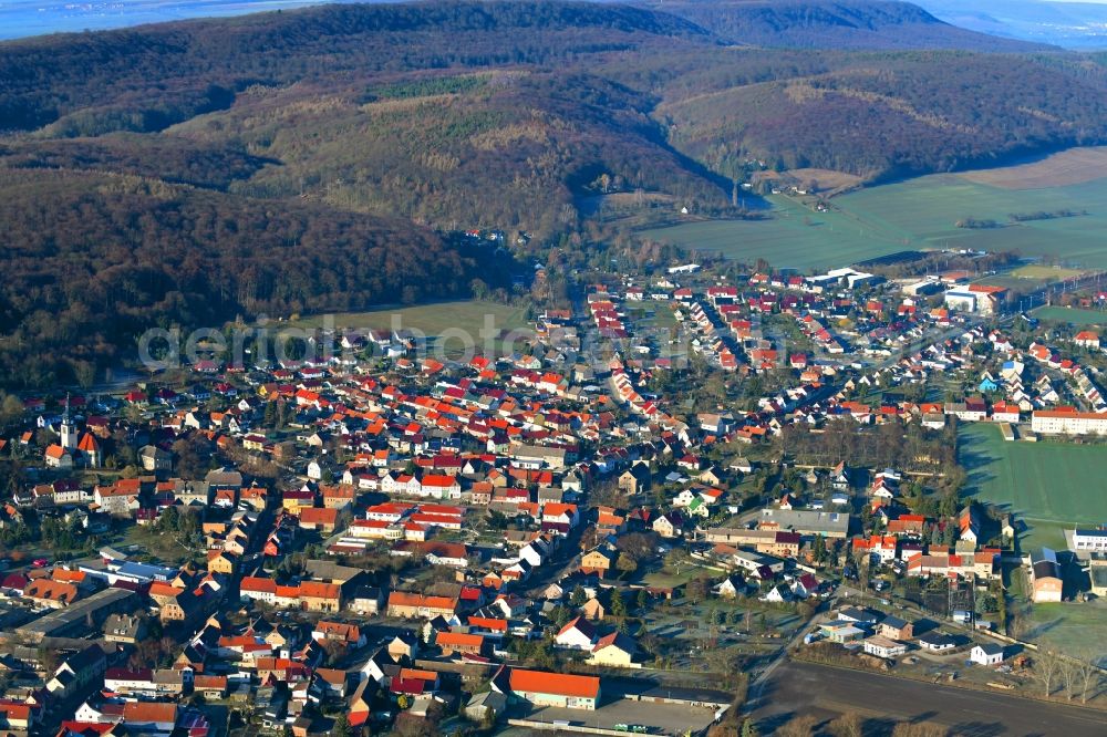 Oldisleben from above - Location view of the streets and houses of residential areas in the valley landscape surrounded by mountains in Oldisleben in the state Thuringia, Germany