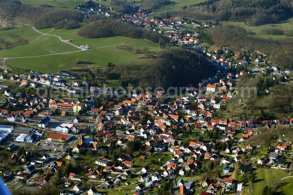 Trusetal from above - Location view of the streets and houses of residential areas in the valley landscape surrounded by mountains in Trusetal in the state Thuringia, Germany