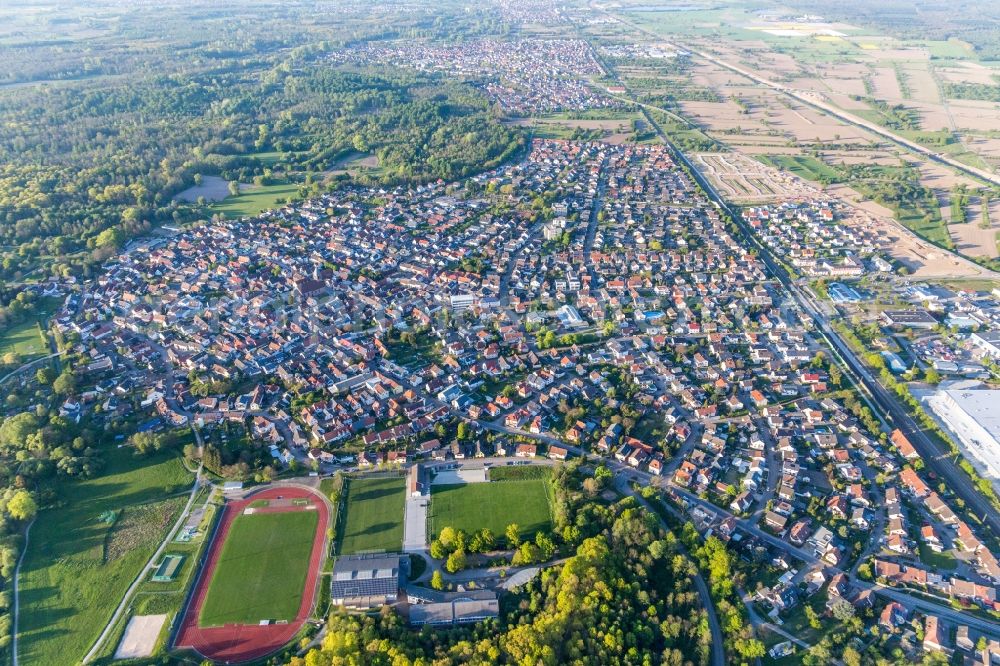 Aerial photograph Ötigheim - Town View of the streets and houses of the residential areas in Oetigheim in the state Baden-Wuerttemberg, Germany