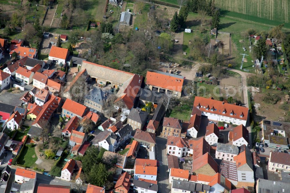 Aerial photograph Undenheim - Town View of the streets and houses of the residential areas in Undenheim in the state Rhineland-Palatinate. Left of center, the historic winery Junghof