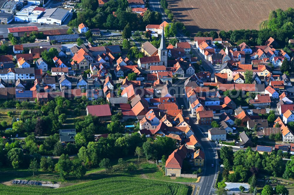 Unsleben from above - Town View of the streets and houses of the residential areas in Unsleben in the state Bavaria, Germany