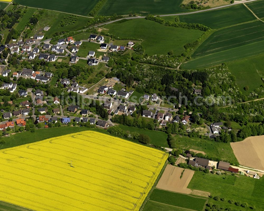 Waldorf from above - View of the borough of Waldorf in the state of Rhineland-Palatinate. The borough is part of the administrative district of Bad Breisig and is surrounded by agricultural fields and rapeseed fields. The Vinxtbach creek takes its course through the locality