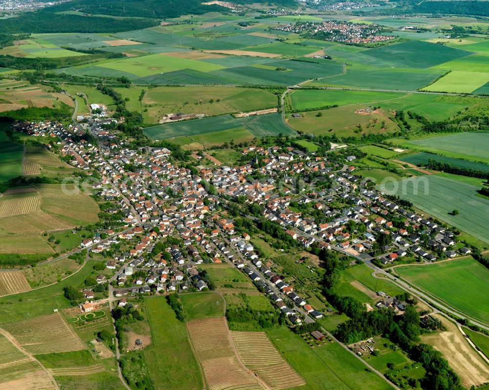 Weinsheim from above - View of Weinsheim in the state of Rhineland-Palatinate. Weinsheim is a borough and municipiality in the county district of Bad Kreuznach. It is located in the Nature Park Soonwald-Nahe. The Ellerbach creek takes its course through the village. Weinsheim includes three hamlets, two churches and the old town hall