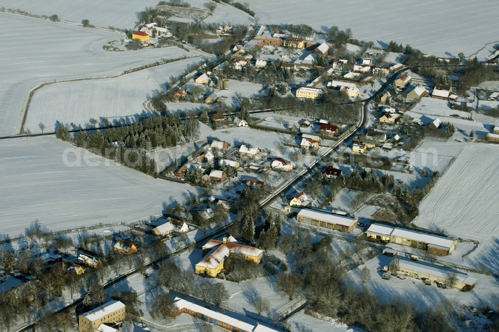 Aerial image Falkenberg - View of the winterly snow-covered village of Kruge-Gersdorf in the state of Brandenburg