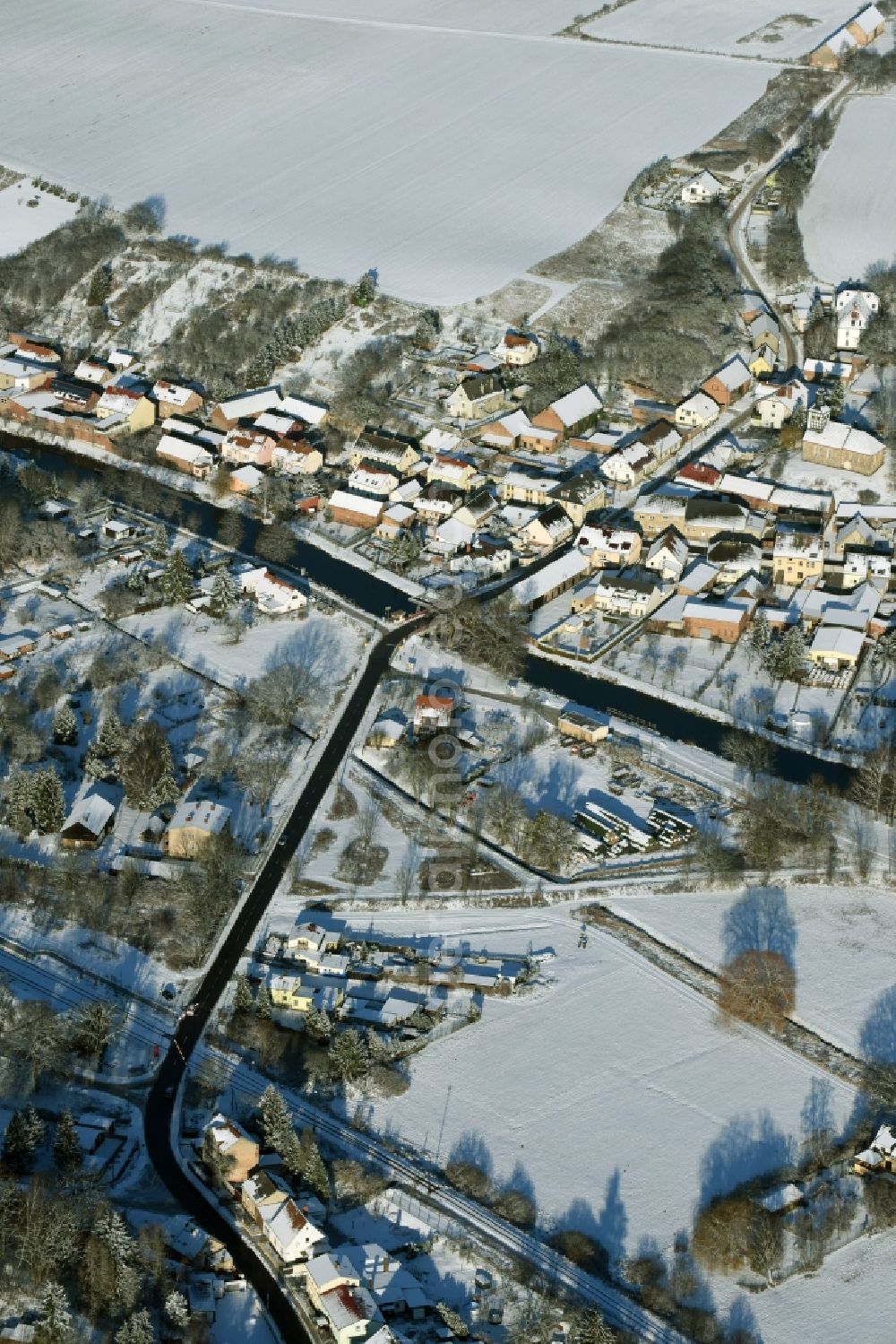 Niederfinow from above - View of the snow-covered winterly village of Niederfinow along the river of Old Finow in the state of Brandenburg