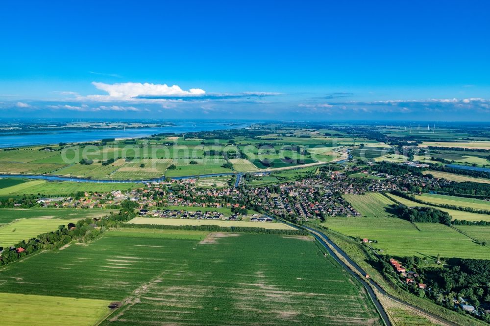 Aerial photograph Wischhafen - Town view of the streets, houses and fields in Wischhafen in the state Lower Saxony, Germany