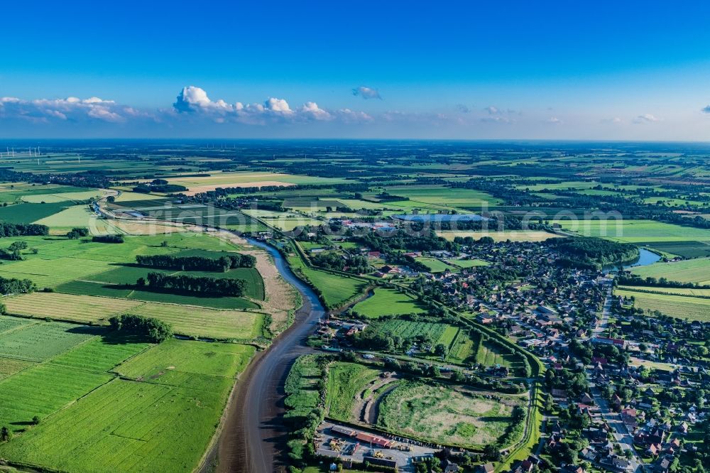 Aerial image Wischhafen - Town view of the streets, houses and fields in Wischhafen in the state Lower Saxony, Germany