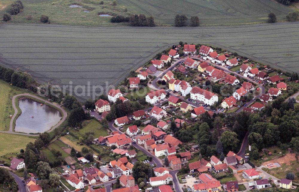 Krauthausen from the bird's eye view: Overlooking the stretch of road - At Eisenach way - in Krauthausen in Thuringia. It was here right on the field near the Etzenbach a residential estate