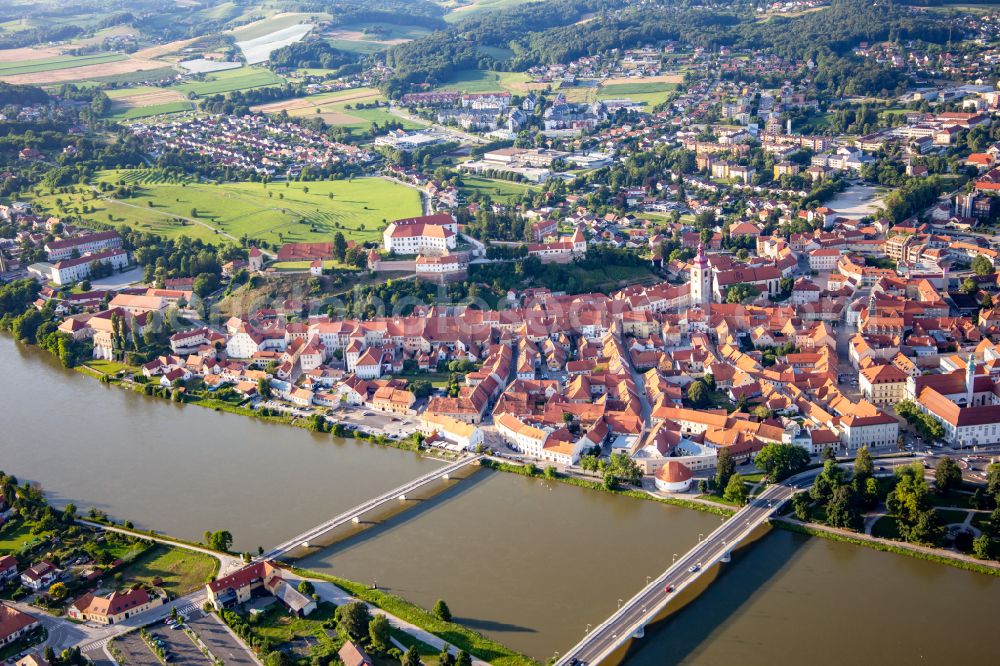 Aerial photograph Ptuj - Town on the banks of the river of Drau/Dravo with pedstrian- and car-bridges in Ptuj in Slovenia