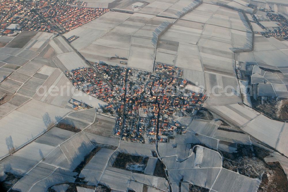 Siefersheim from the bird's eye view: The local community Siefersheim in winter. A contemplative snowed village with surrounding snowcapped fields in the Alzey-Worms in Rhineland-Palatinate